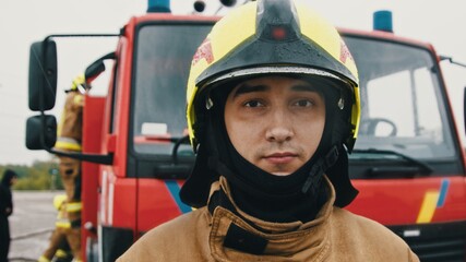 Portrait shot of the fireman in full uniform ready for the rescue. High quality photo