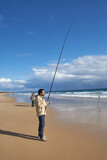 Fototapeta Boho - photograph of a fisherman on the beach