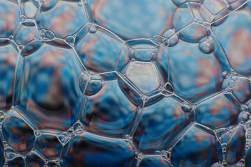 blurry abstract background of colored soap bubbles in water