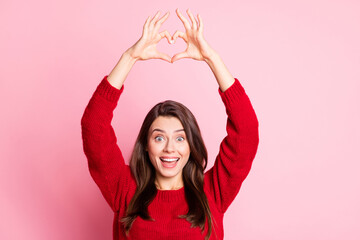 Sticker - Photo of young charming girl raise hands open mouth show heart shape wear red sweater isolated pink color background