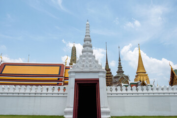 Temple of the Emerald Buddha, Wat Phra Kaew, Wat Phra Si Rattana Satsadaram. Architecture of gate, church, pagoda and wall of siamese temple in Bangkok