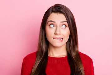 Sticker - Portrait photo of troubled young girl with guilty face biting lip looking at side isolated on pink color background