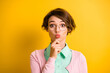 Photo of pensive clever lady finger chin pout lips send air kiss wear teal shirt pink cardigan isolated yellow color background
