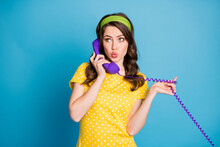 Photo Portrait Of Girl Gossiping Over Purple Wired Telephone Isolated On Pastel Light Blue Colored Background