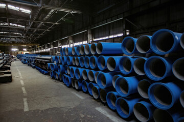 Wall Mural - New cast iron pipes for pipeline construction in warehouse