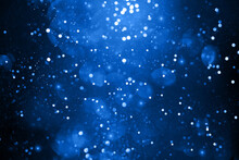 Abstract Bokeh On Dark Blue Background. Holiday Concept