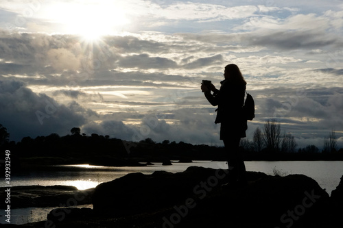 Cuadros en Lienzo Woman taking photos in Los Barruecos, granite formations and ponds with great an