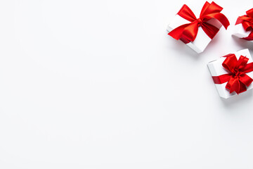 Wall Mural - gifts with red ribbon, present on white background top view. valentine's day. birthday. women's day.