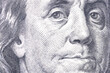 Macro close up of Ben Franklin's face on the US $100 dollar bill