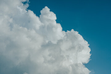 White cumulus clouds on blue sky