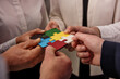 © alphaspirit - Teamwork of partners. Concept of integration and startup with puzzle pieces