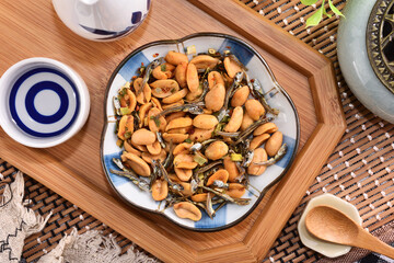 Wall Mural - Peanuts & spicy scallion flavor fish on plate 