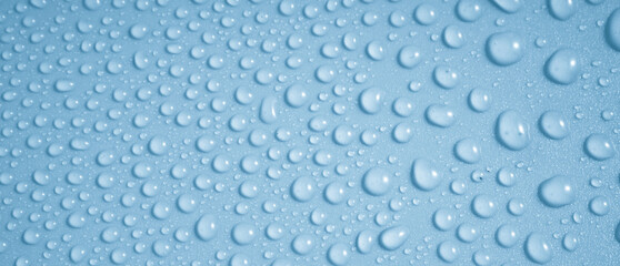 Wall Mural - water drops on blue background