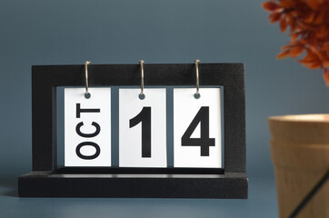 October 14, Date design with a black wooden calendar for a business, Date Plans to remind.