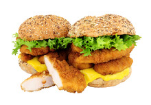 Breadcrumb Covered Chicken Fillet Sandwiches In Multigrain Seed Covered Bread Rolls Isolated On A White Background