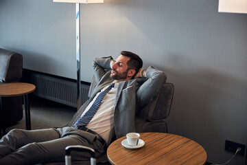 Wall Mural - Businessman is napping on a small bed