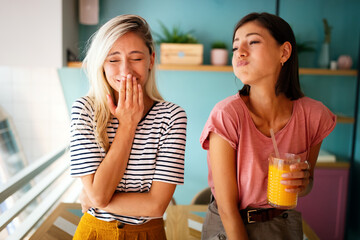 Wall Mural - Portrait of a beautiful women friends smiling and having fun together