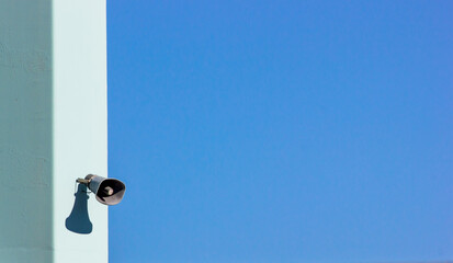 Canvas Print - Closeup of a floodlight on a white wall at a sports' arena that illuminates the area at night