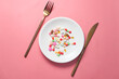 © Towfiqu Barbhuiya  - close up of colorful pills on plate