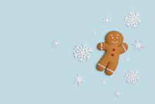 Classic Gingerbread Cookie Hero Isolated On Blue With Decorative Showflakes
