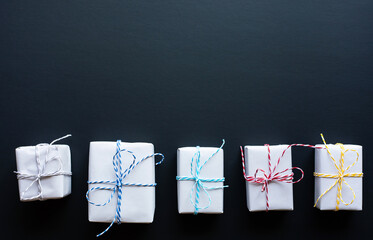 Wall Mural - simple gift box in diy style on dark background.giving and anniversary cocepts idea