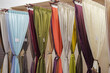 Displayed colorful curtain samples in the shop.