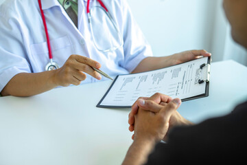 The doctor is examining the patients according to the checklist, annual visits to the doctor for physical examination. And follow the symptom check after taking medicine, health examination concept