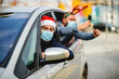 © Ana - Friends wearing a protective face mask in the car. Holidays during epidemic.