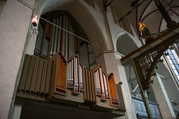 Pipe organ and wooden sculpture of the Virgin Mary in the town church of Gadebusch in northern Germany