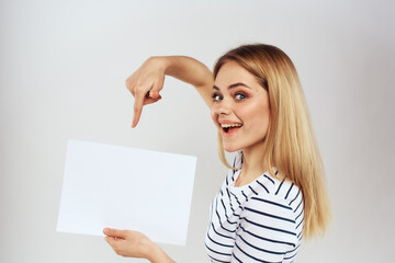 Sticker - woman holding a sheet of paper in her hands lifestyle striped t-shirt cropped view Copy Space