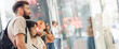 © guruXOX - Group of people in shopping mall looking new fashion clothes at shop window of a boutique. Shop sales. Black friday concept