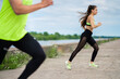 © Georgii - Running athletic couple in stylish sportswear on workout outdoors, healthy sport lifestyle