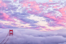 Scenic View Of Golden Gate Bridge Covered With Fog During Sunset