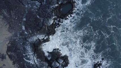 Sticker - Top view of powerful sea waves rolling and splashing in slow motion ne