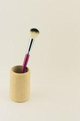 Wall Mural - Vertical shot of a painting brush in a wooden can