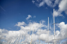 Sailing Masts In The Harbor Of Scheveningen With Clouds