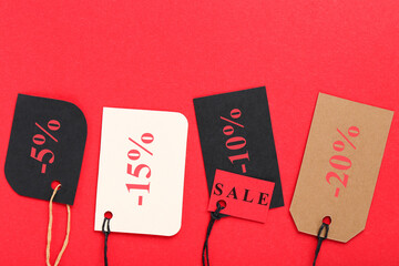 Poster - Colorful sale tags on red background