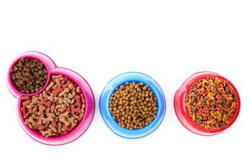 Wall Mural - Dry pet food in bowls isolated on white background