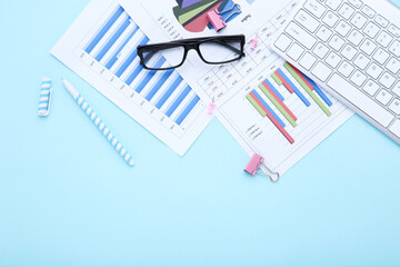 Poster - Computer keyboard with diagrams and glasses on blue background