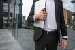 © zinkevych - Close up picture of a man in a suit with a laptop
