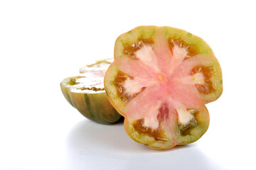 Canvas Print - Halved black tomato on white background