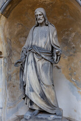 Historic Statue on the autumn mystery old Prague Cemetery, Czech Republic