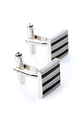 Wall Mural - Silver cuff links on white background