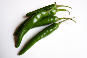 Sticker - Closeup of green chili peppers on the white background