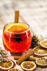 Wall Mural - Christmas drink sangria or mulled wine, or bray, with apples, oranges, pomegranate and cinnamon sticks.