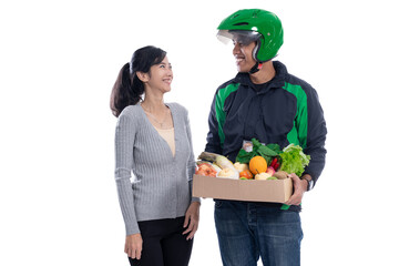 Wall Mural - grocery store delivery. driver courier with food sending online order to female customer isolated over white