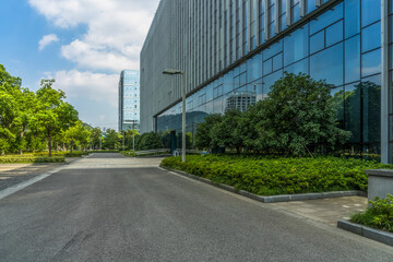 Wall Mural - clean asphalt road through office block area, suzhou, china