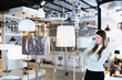 © JackF - Portrait of cheerful positive glad girl buyer choosing floor lamp in furniture