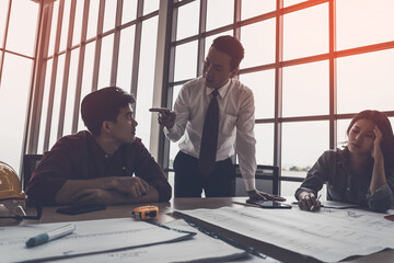 Wall Mural - Angry Construction Boss is brainstorming with Engineer and Architect team in a Building contractor meeting.