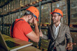 © zinkevych - Manager having a conversation with the warehouse worker and looking angry